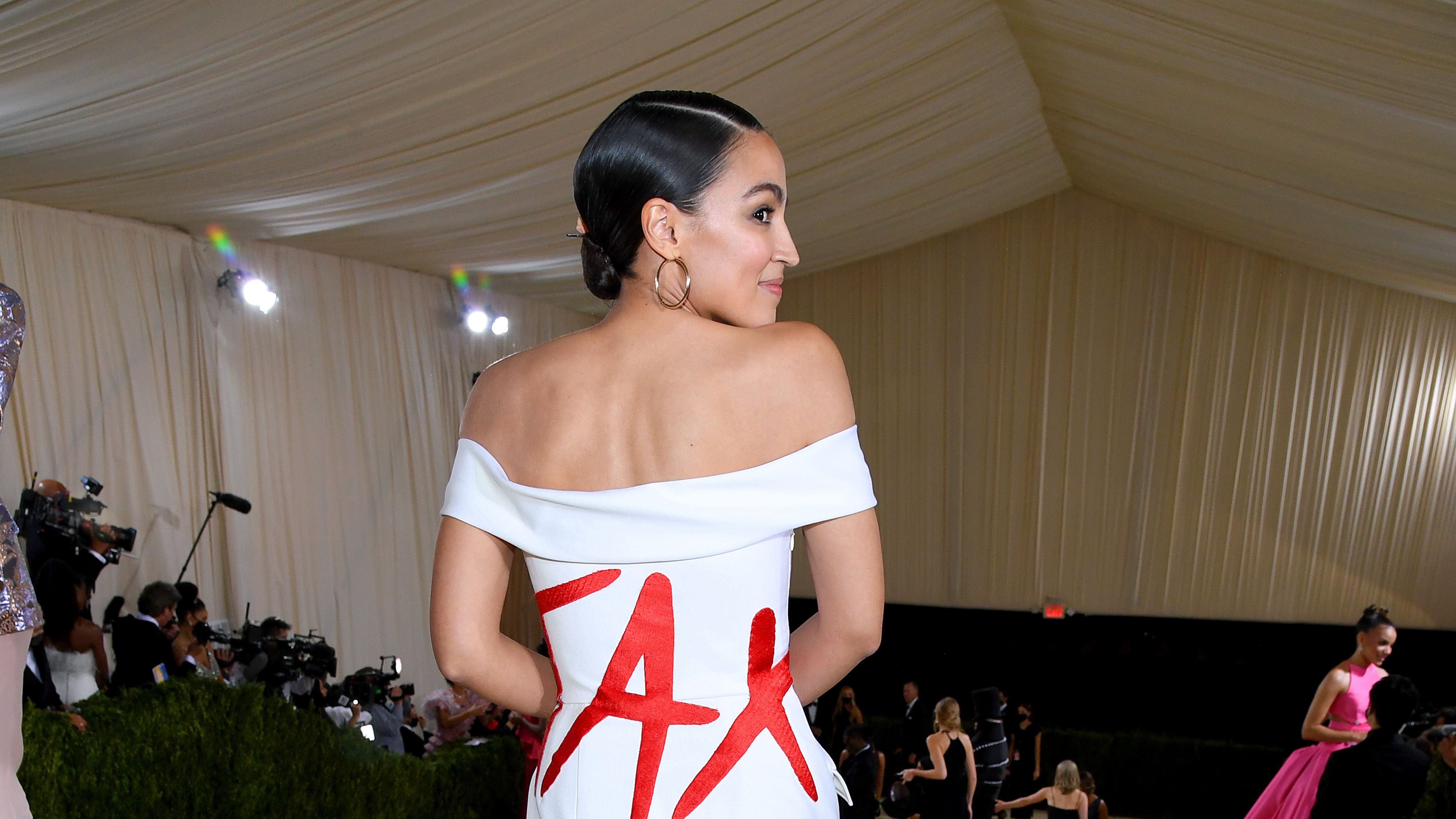 aoc sheer dress Alexandria Ocasio-Cortez Goes Classic in Black Dress on 'Seth Meyers'