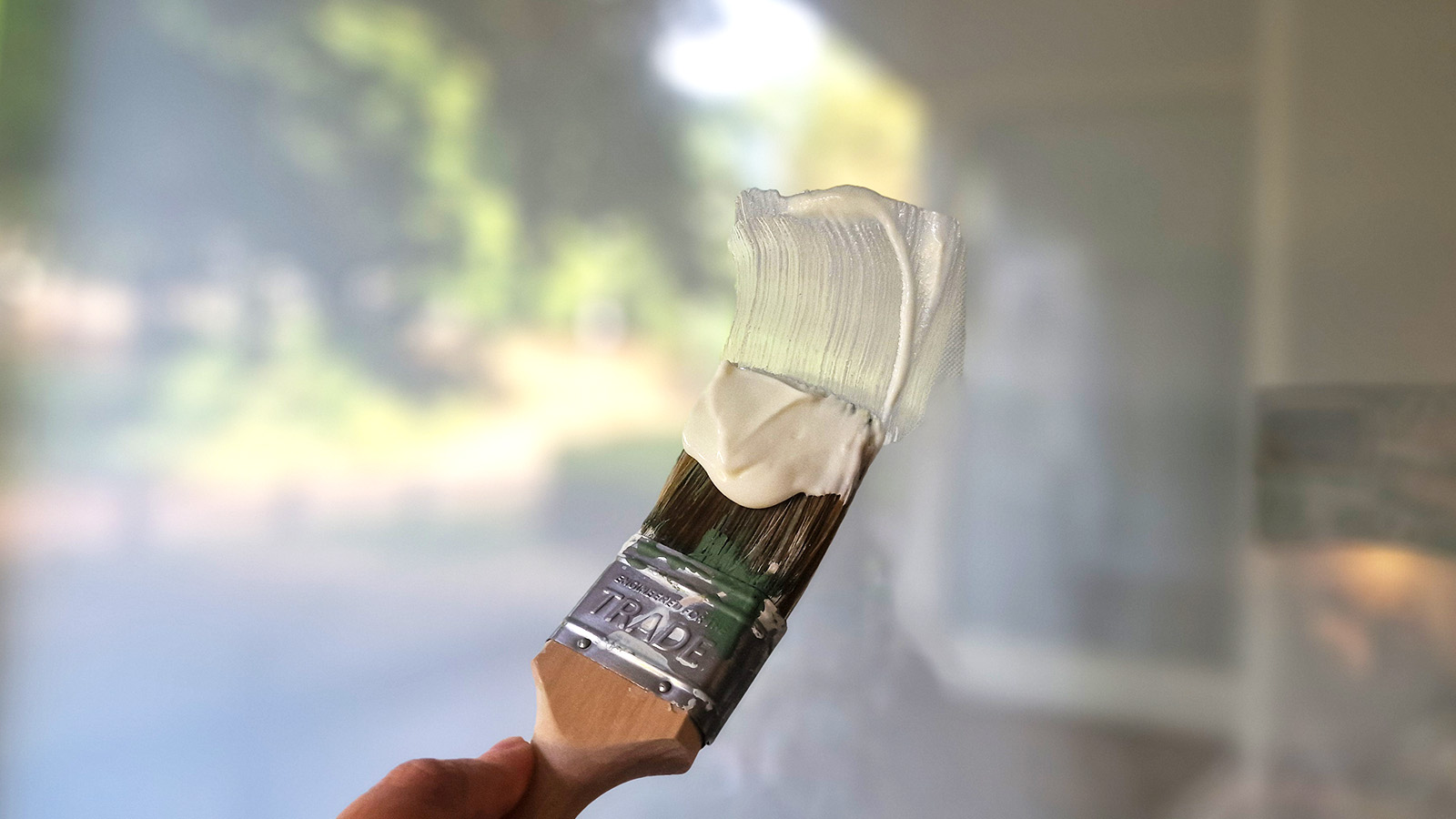 spreading yogurt on a window