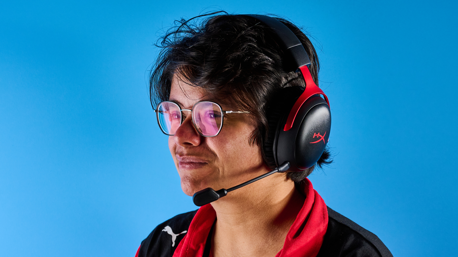 A black and red HyperX Cloud III S Wireless gaming headset