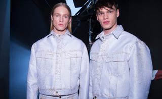 Models wearing clothing by Calvin Klein
