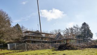 oak frame self build during construction with crane