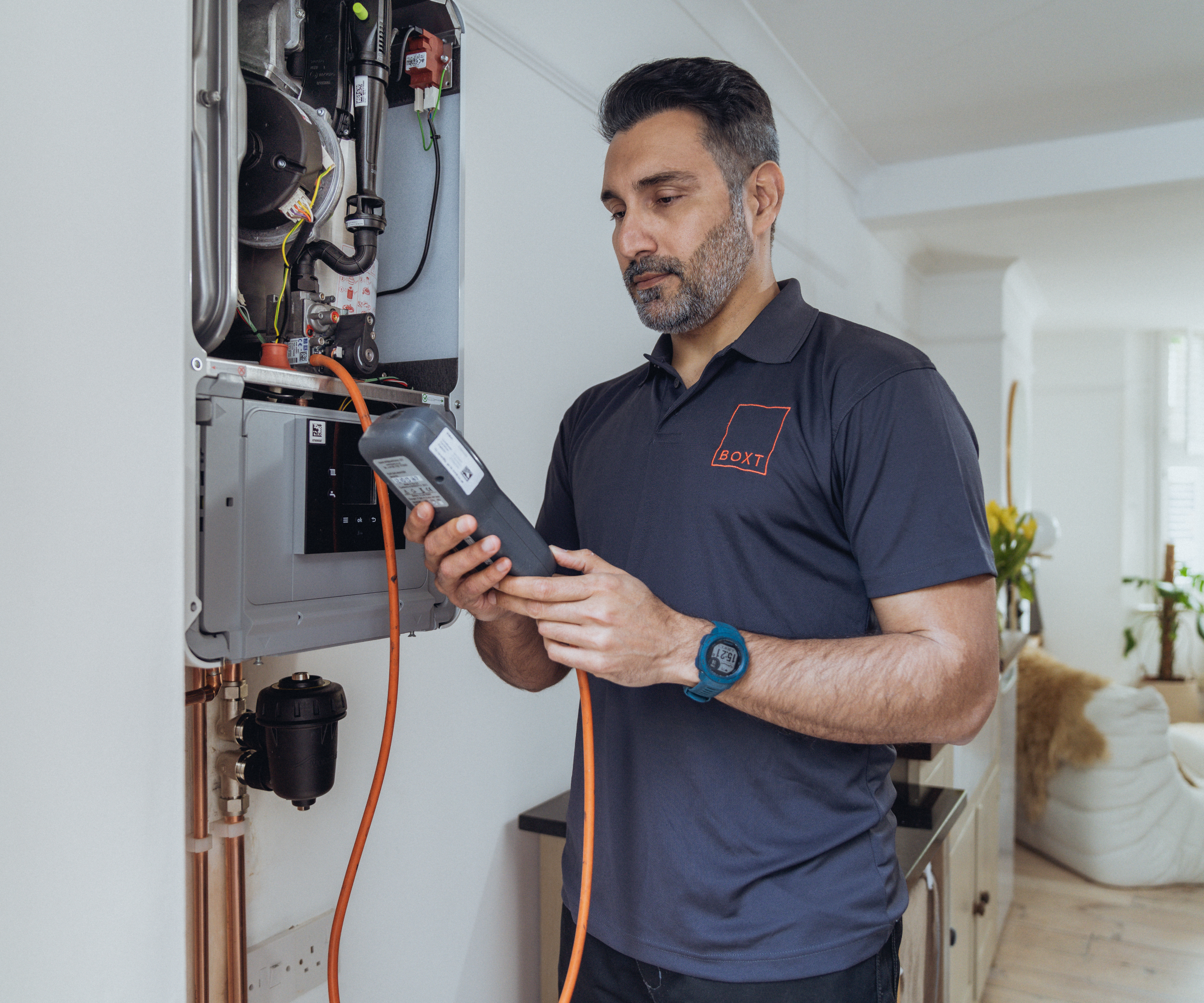 engineer checking boiler