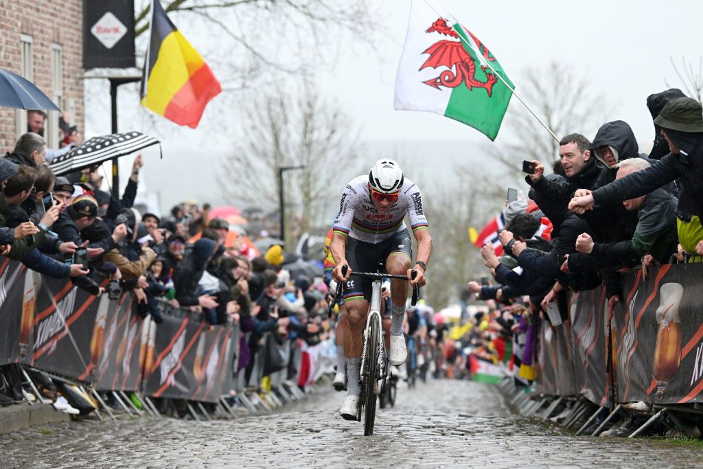 OUDENAARDE BELGIUM MARCH 31 Mathieu van der Poel of The Netherlands and Team Alpecin Deceuninck attacks passing through a cobblestones sector while fans cheer during the 108th Ronde van Vlaanderen Tour des Flandres 2024 Mens Elite a 2708km one day race from Antwerpen to Oudenaarde UCIWT on March 31 2024 in Oudenaarde Belgium Photo by Dario BelingheriGetty Images