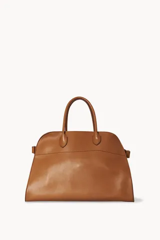 a brown top-handle tote bag in leather