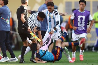Argentina's midfielder #05 Leandro Paredes (top) clashed with Spain's midfielder #09 Gavi during the 2026 World Cup football tournament final match between Spain and Argentina at the New York/New Jersey Stadium in East Rutherford on July 19, 2026. (Photo by CHARLY TRIBALLEAU / AFP)