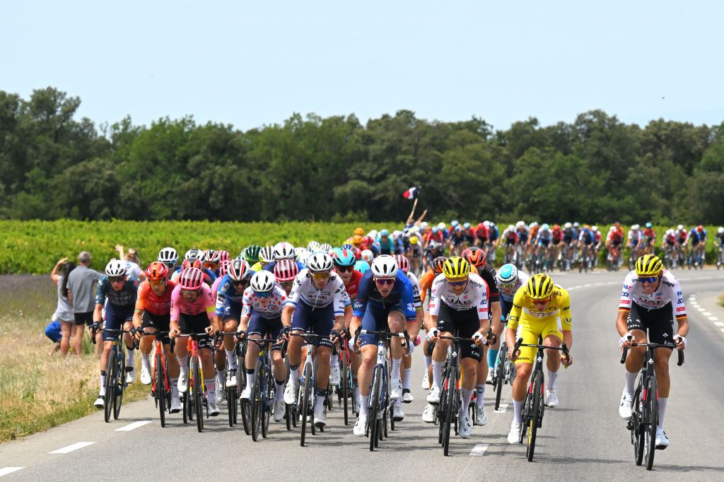 SUPERDEVOLUY LE DEVOLUY FRANCE JULY 17 LR Bart Lemmen of Netherlands and Team Visma Lease a Bike Michal Kwiatkowski of Poland and Team INEOS Grenadiers Ben Healy of Ireland and Team EF Education EasyPost Jonas Vingegaard Hansen of Denmark Polka Dot Mountain Jersey Christophe Laporte of France and Team Visma Lease a Bike Stefan Kung of Switzerland and Team Groupama FDJ Tim Wellens of Belgium Tadej Pogacar of Slovenia Yellow Leader Jersey and Nils Politt of Germany and UAE Team Emirates compete in echelons formation due to the due crosswind during the 111th Tour de France 2024 Stage 17 a 1778km stage from SaintPaulTroisChateaux to Superdevoluy 1500m UCIWT on July 17 2024 in Superdevoluy Le Devoluy France Photo by Tim de WaeleGetty Images