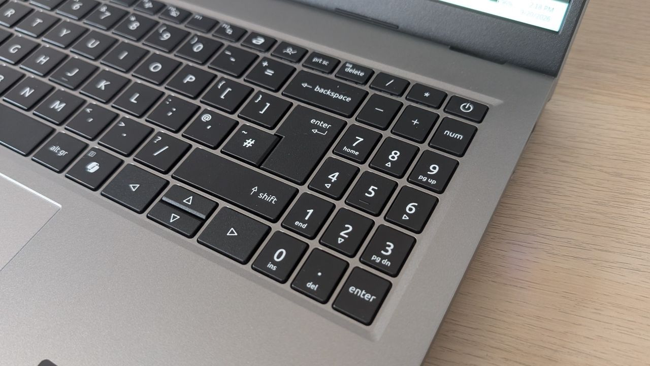 The Acer Aspire Go on the ITPro background