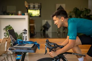 Image shows a person using ERG mode in Zwift