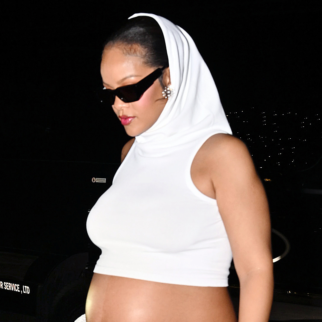 Rihanna wears a cropped hooded top with a matching skirt