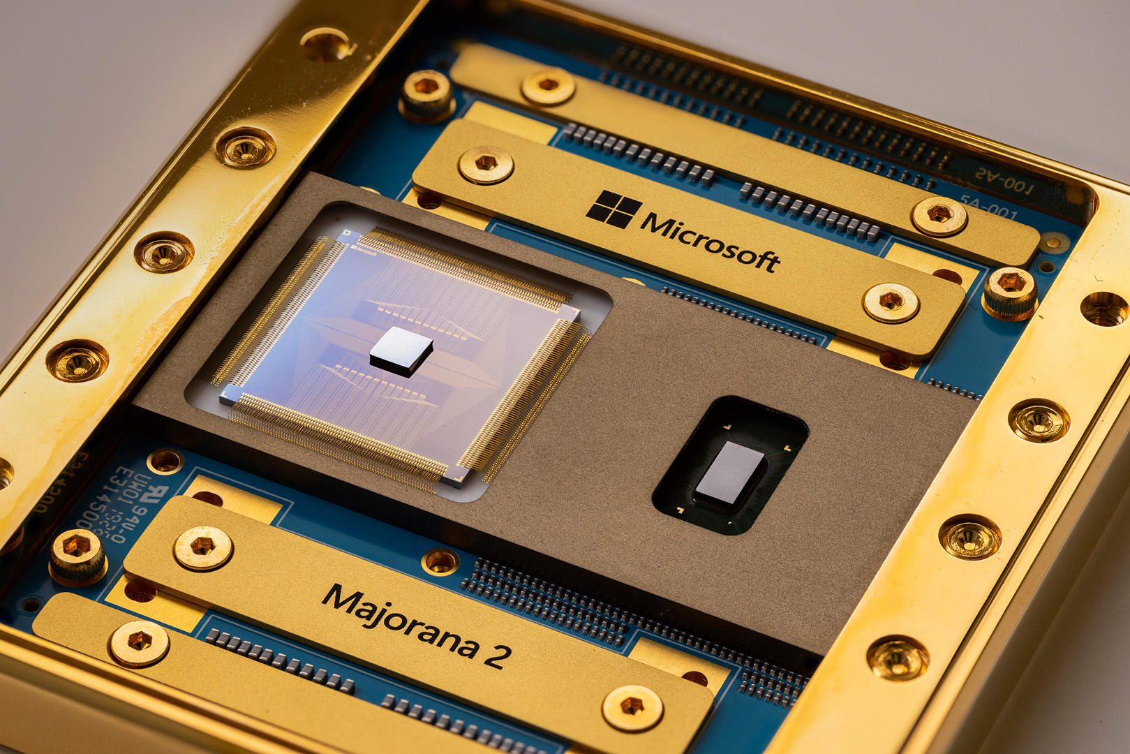A close up of a golden chip with a circuit board underneath