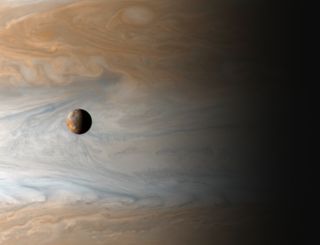 a small moon against the swirling background that is Jupiter.