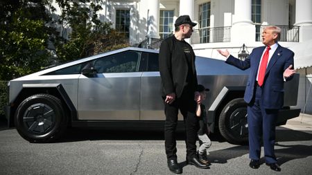 Elon Musk and President Donald Trump in front of a Cybertruck