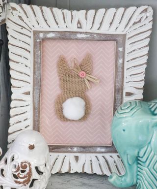 DIY burlap bunny with cotton tail in photoframe.
