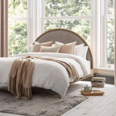 Aubery bed with white and pale pink bedding and oval headboard