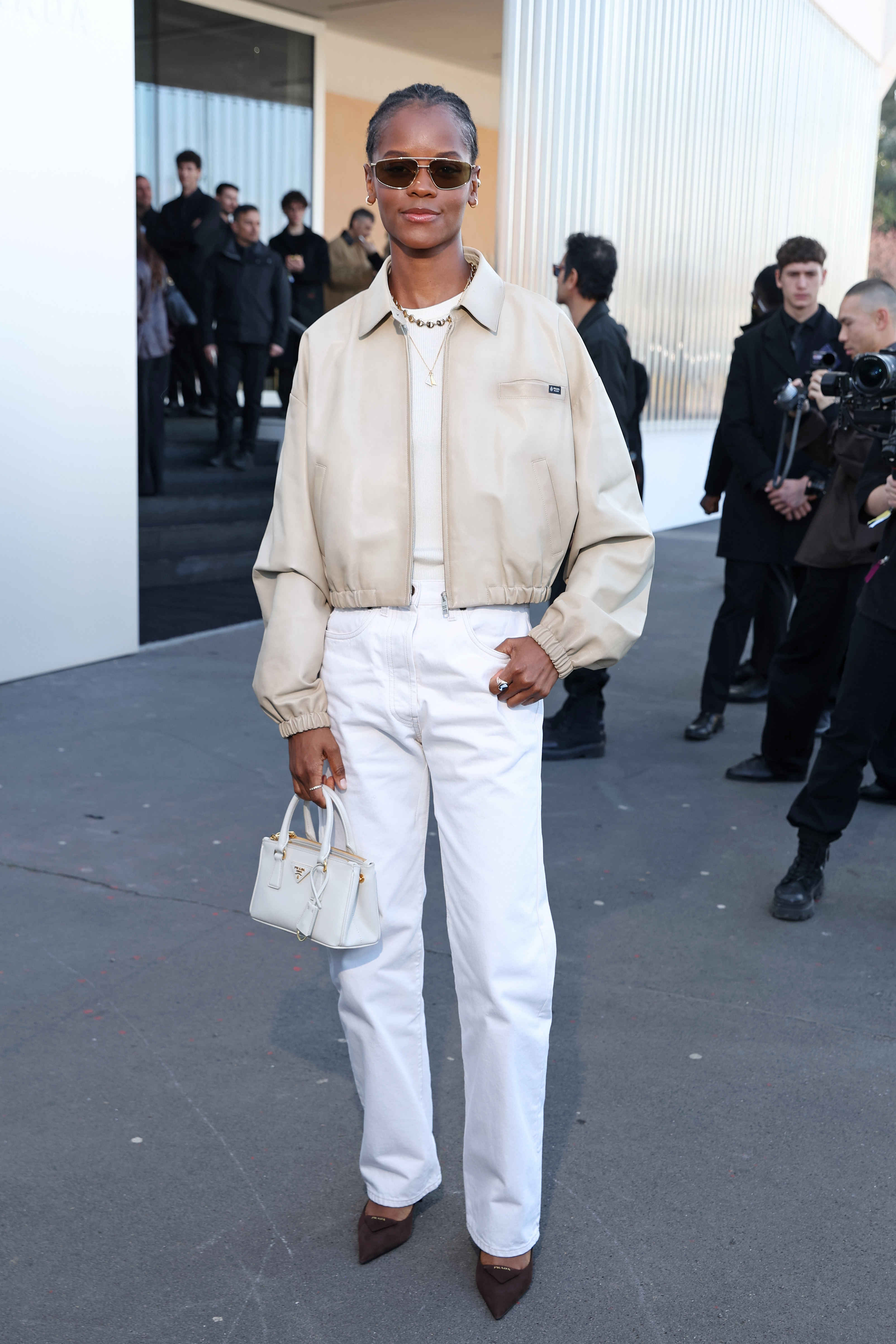 Letitia Wright attended the Prada fashion show in white jeans Feb 26