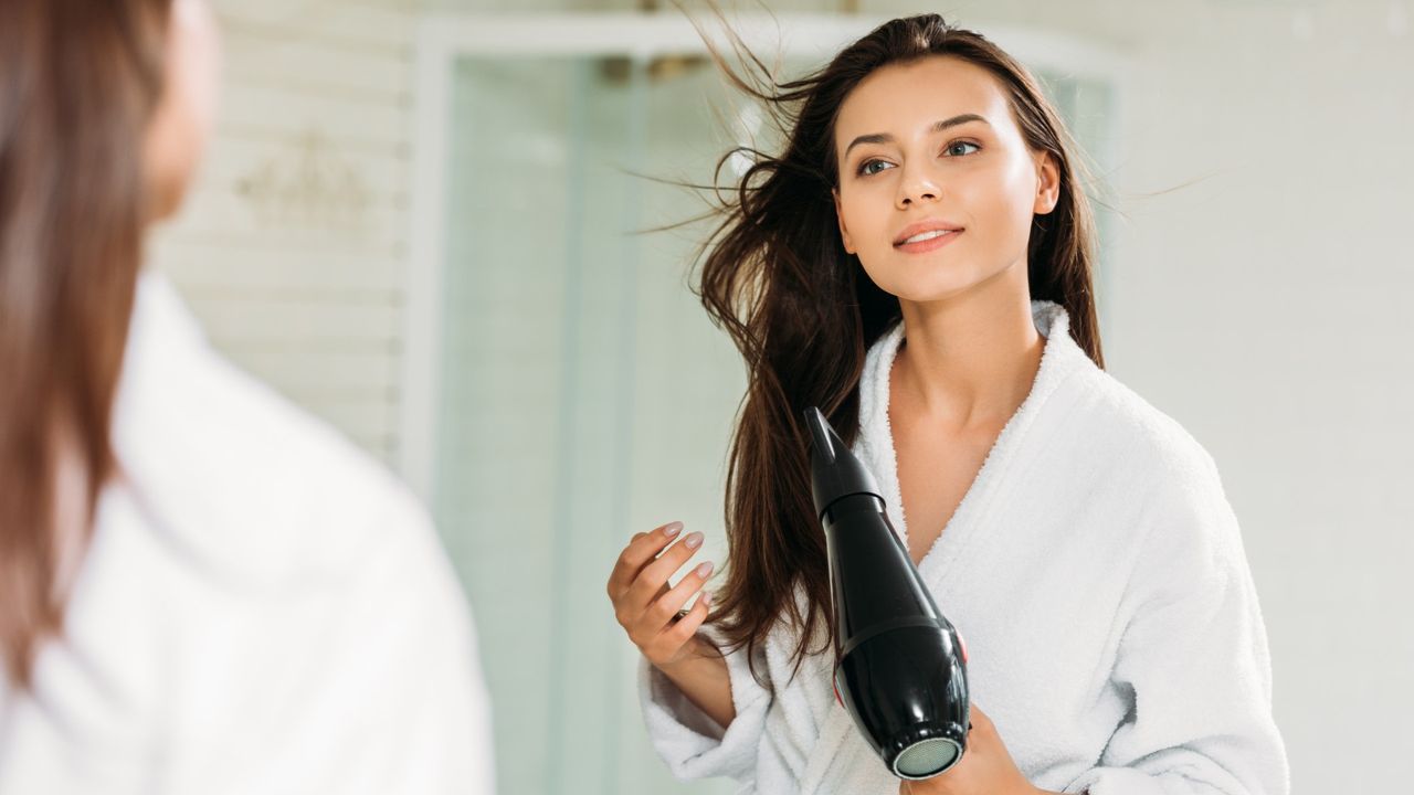 woman blow dryer hair