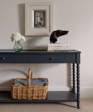 Chelsea Textiles grey bobbin console table with natural rug and artwork