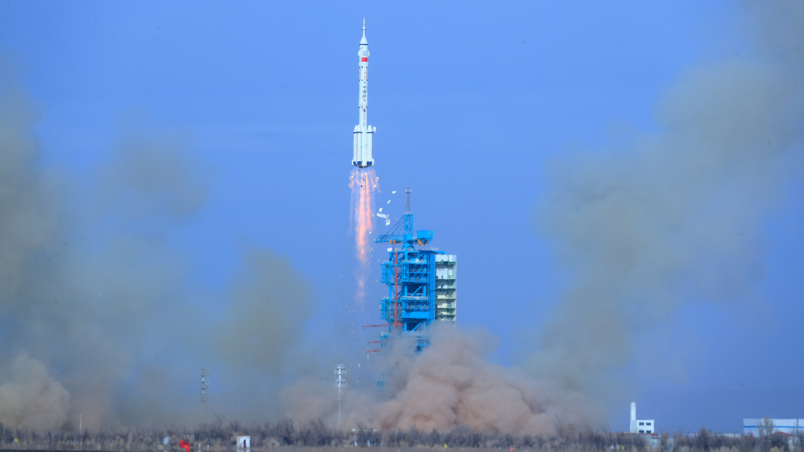 A photo of a rocket taking off from a launch pad in China
