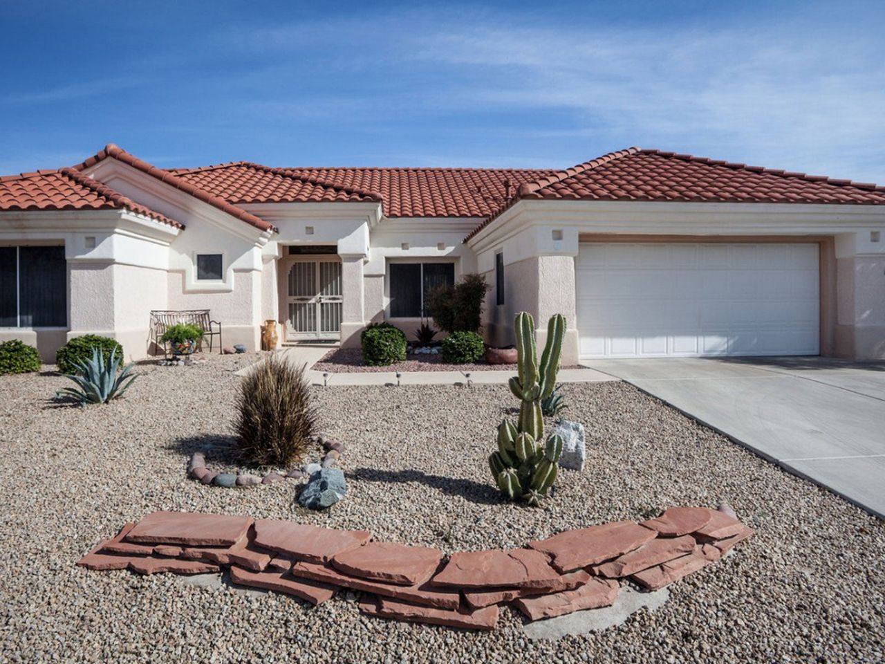 Grassless Front Yard Landscape Of Rocks And Cacti Plants