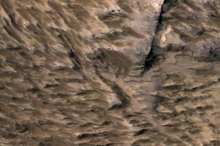 Landslides Near Fresh Crater on Mars