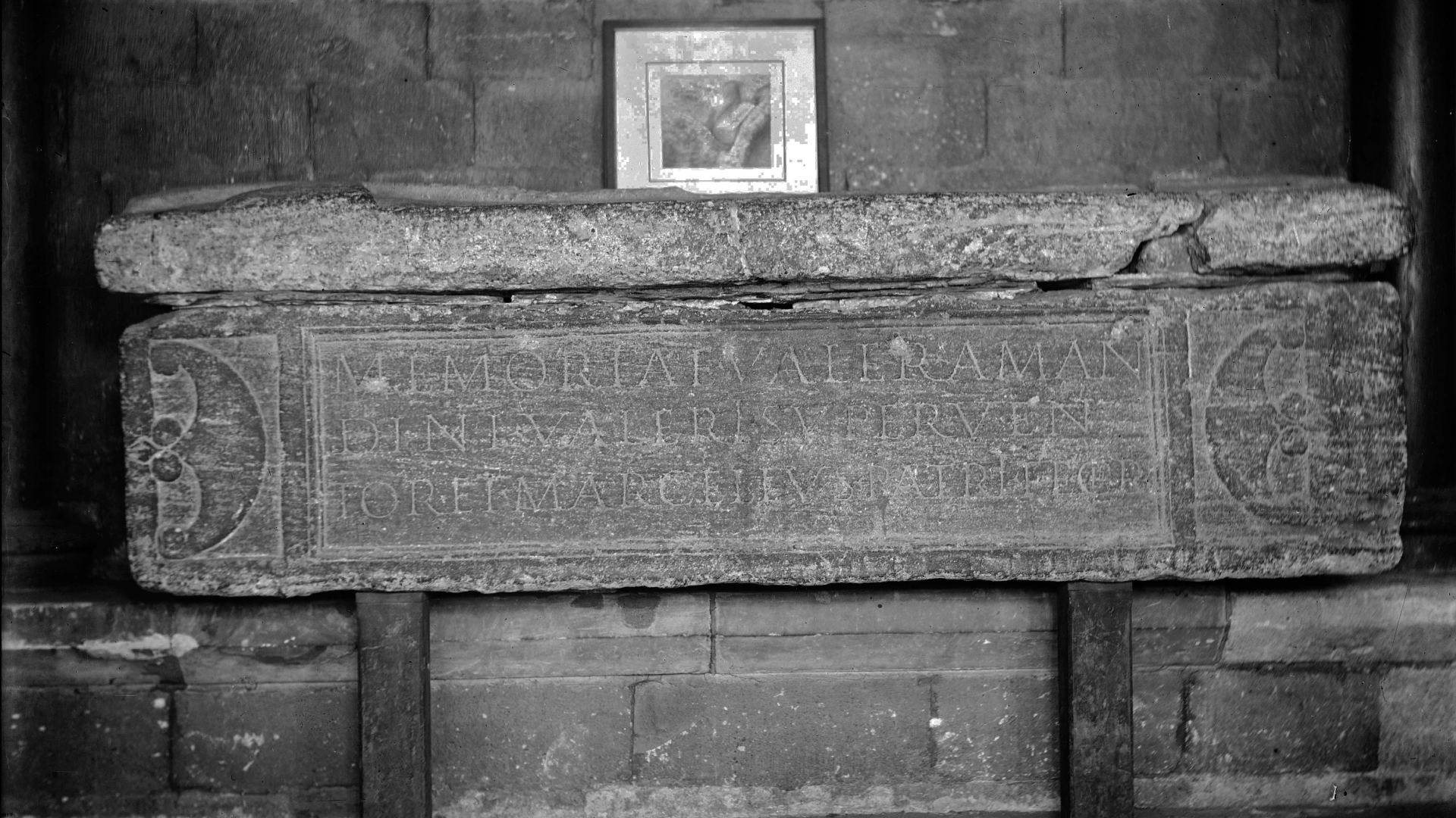 a black-and-white photograph of the side of a Roman sarcophagus showing an inscription