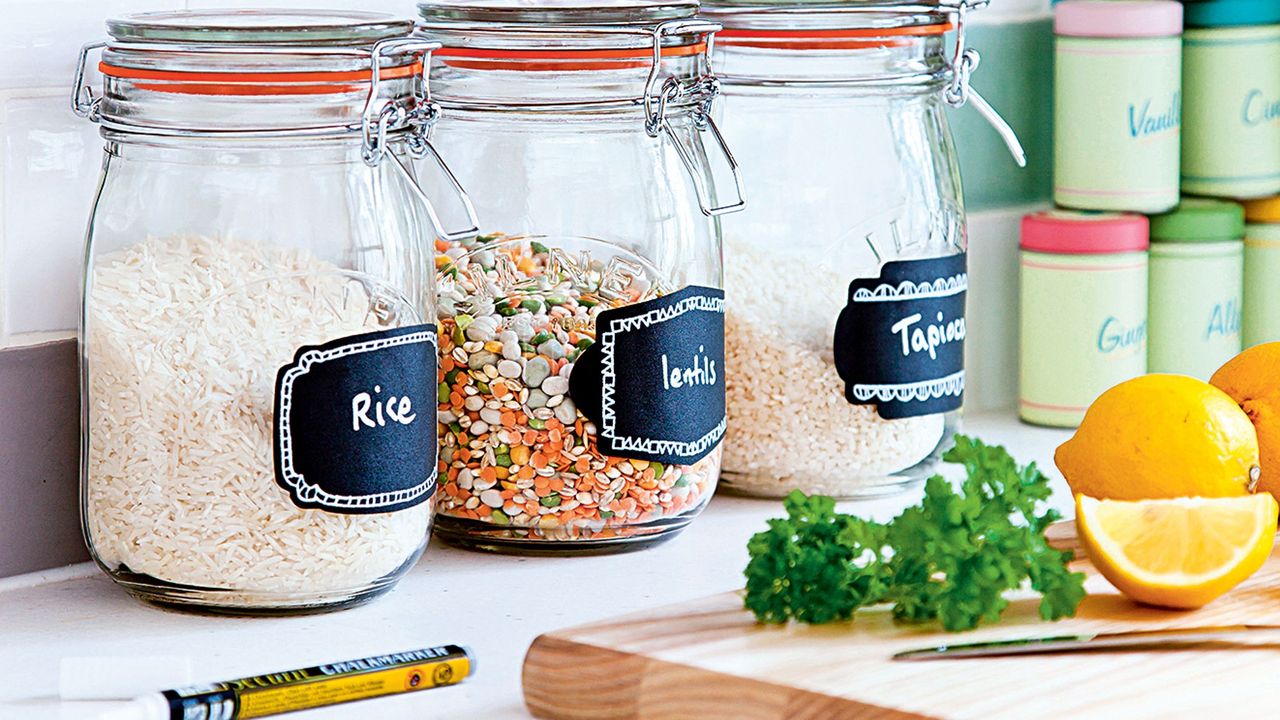 kitchen with glass jars lemon and wooden chopping pad