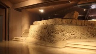 Remains of the Heroon, a small temple built for the burial cluster of Philip II at the Museum of the Royal Tombs inside the Great Tumulus of Aigai (Aegae)