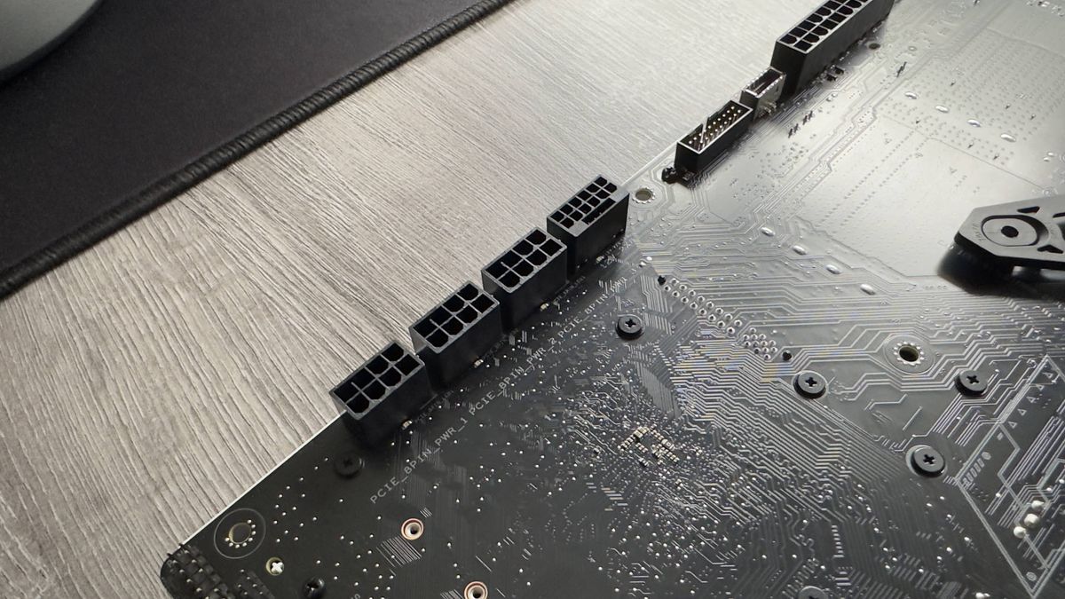Asus TUF Gaming Z790-BTF motherboard on a grey desk