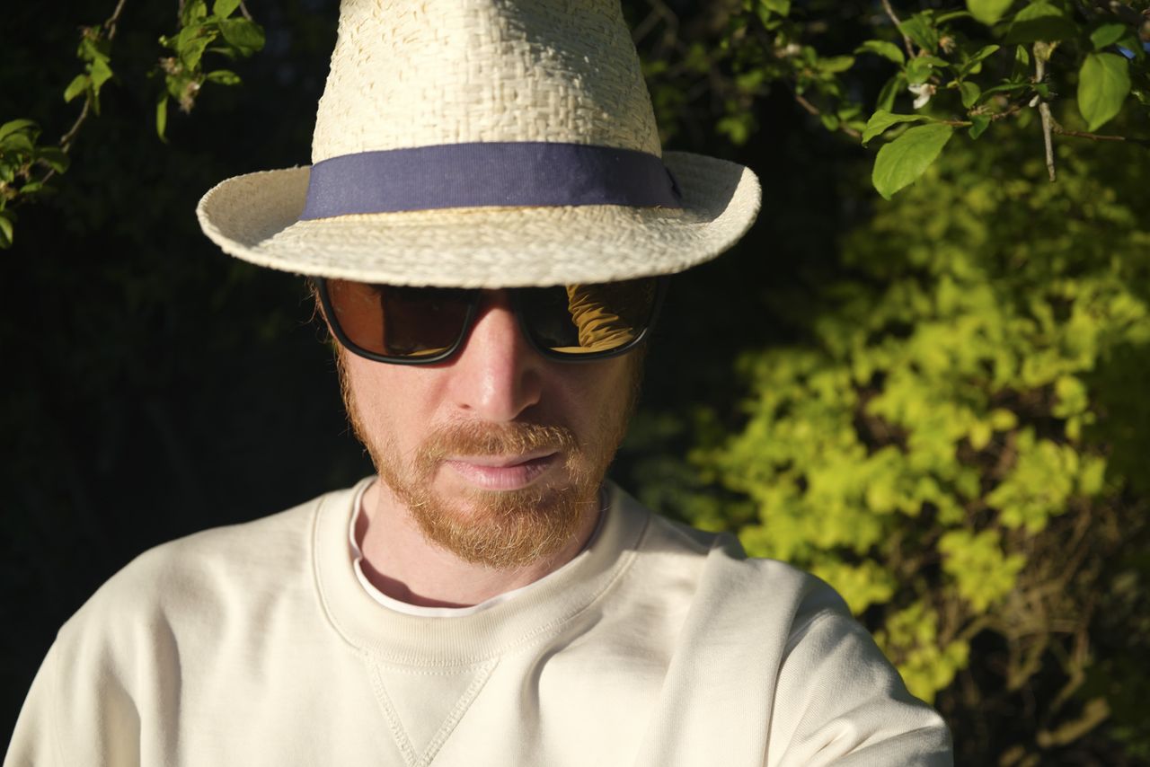 Fujifilm GFX100 RF sample images &ndash; portrait of man in a trilby and shades, in the sun