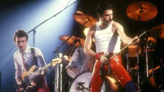 Photo of Freddie MERCURY and John DEACON and QUEEN; John Deacon and Freddie Mercury performing live on stage at Groenoordhallen, Lieden