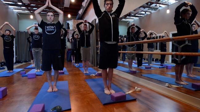 The Whole Athlete-Specialized do some yoga at team camp