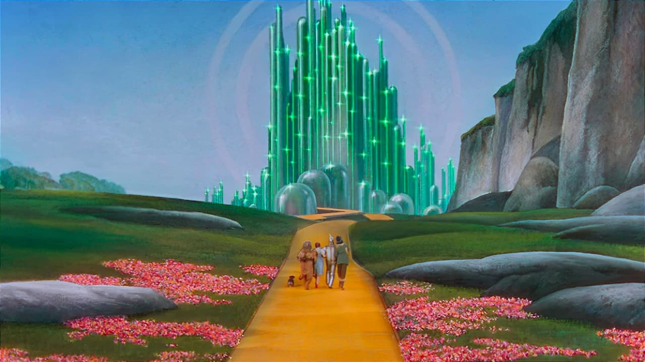 four travelers and a dog approach the gleaming green towers of a magical city