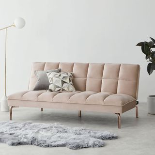 hallie sofa bed with white walls and cushion