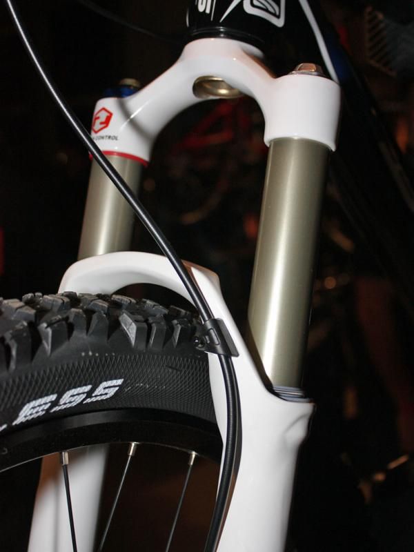 Finally! RockShox has ditched zip-ties with this clean-looking proper clamp on the revised arch.