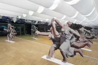 Gae Aulenti retrospective in Milan exhibition installation of female figures, caught in motion