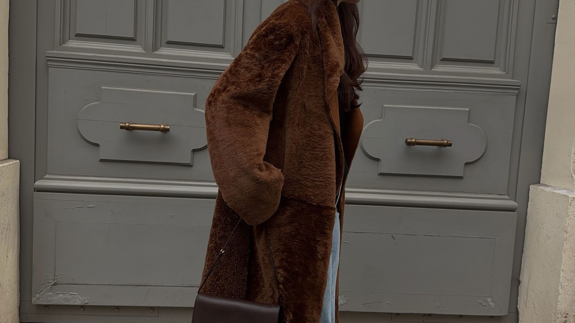 @annabelrosendahl in brown Nour Hammour shearling coat.