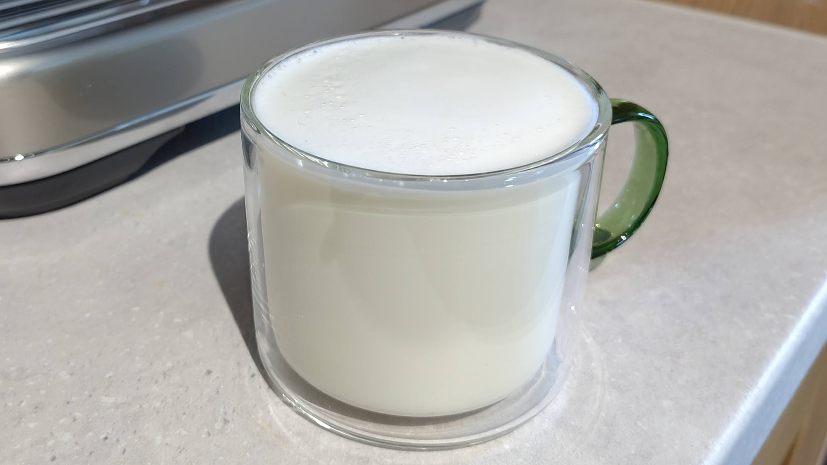 Dairy milk foamed using Sage Barista Touch Impress with Cold Brew