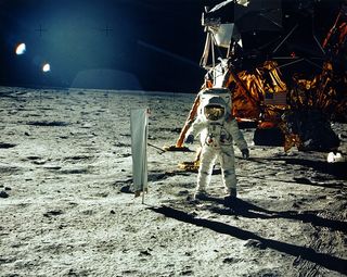 Apollo 11 lunar module pilot Buzz Aldrin kicks up moon dust during a moonwalk on NASA"s historic first manned lunar landing mission in July 1969.