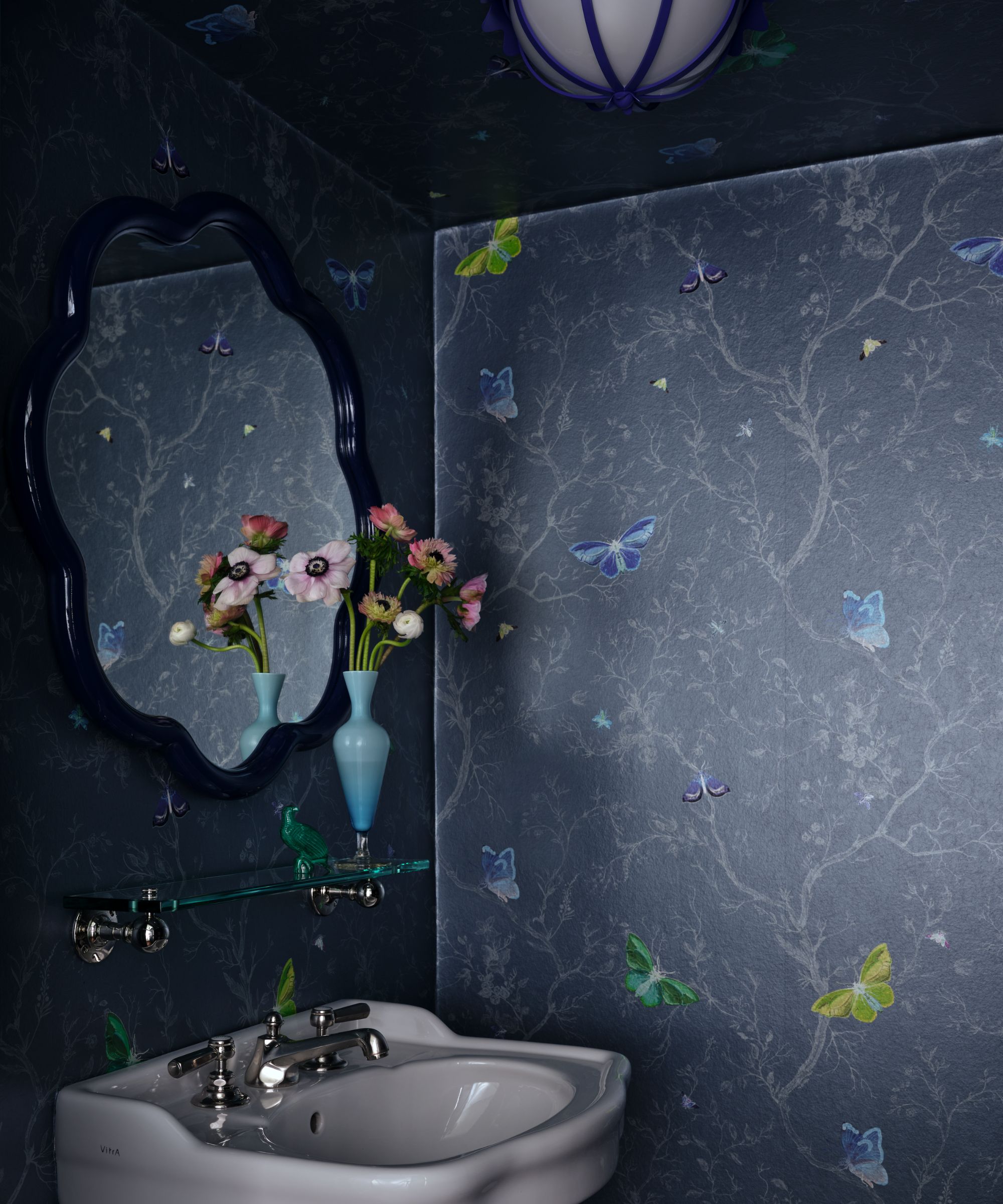 A small powder room with dark navy butterfly motif wallpaper on the walls and ceiling, a small sink with chrome hardware, and a scalloped mirror on the wall