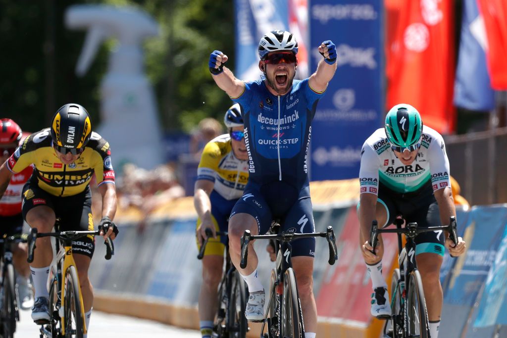 BERINGEN BELGIUM JUNE 13 Mark Cavendish of The United Kingdom and Team Deceuninck QuickStep celebrates at arrival ahead of Dylan Groenewegen of Netherlands and Team Jumbo Visma L Pascal Ackermann of Germany and Team Bora Hansgrohe R during the 90th Baloise Belgium Tour 2021 Stage 5 a 1787km stage from Turnhout to Beringen baloisebelgiumtour on June 13 2021 in Beringen Belgium Photo by Bas CzerwinskiGetty Images