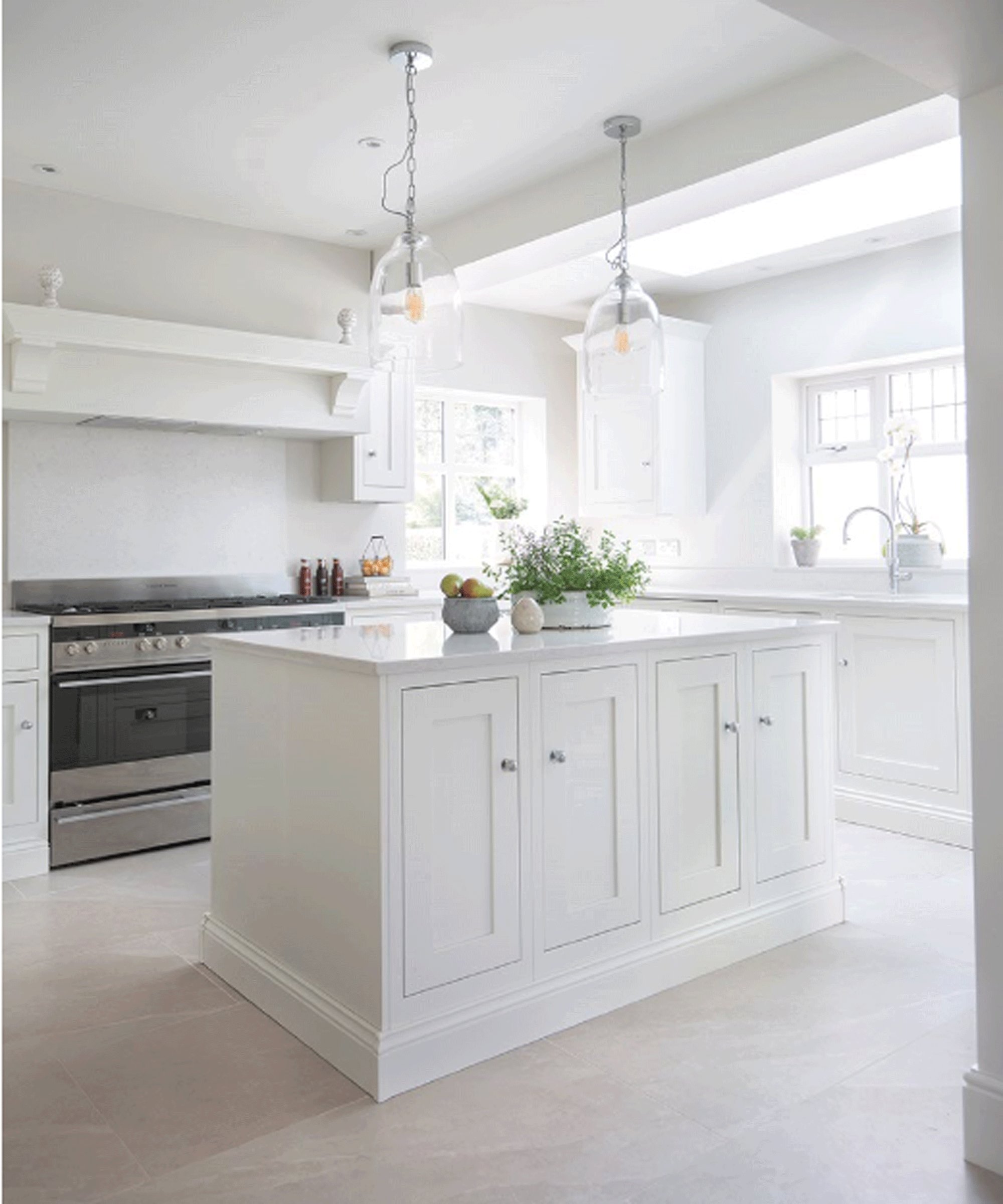 White kitchen with white walls and a large window