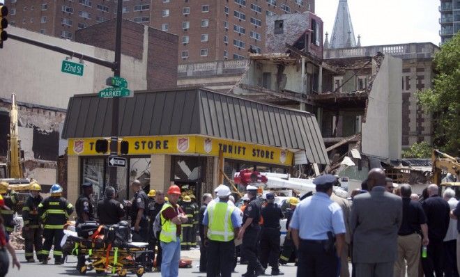 Rescue workers search for victims after a building at a demolition site collapsed in an apparent accident on June 5 in Philadelphia. 