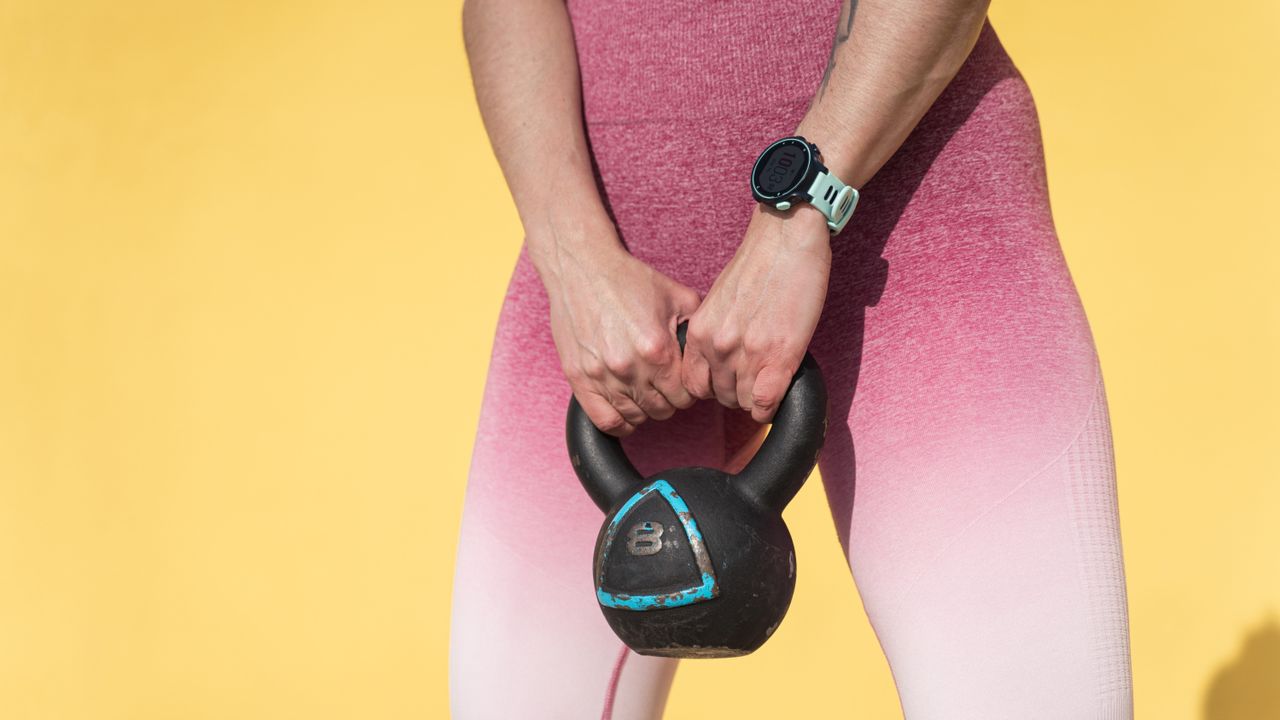 person holding a kettlebell