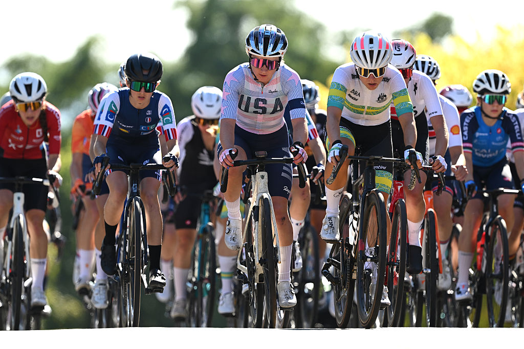 The bunch of riders pictured head-on