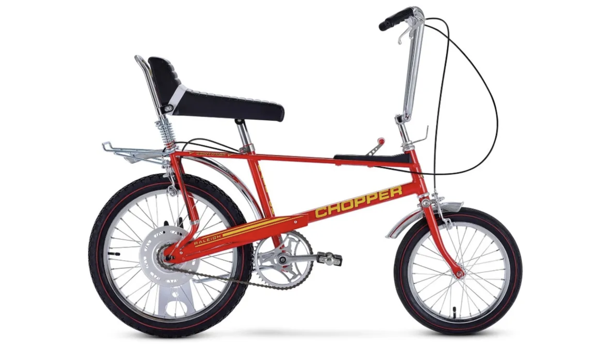Studio shot of a bright red Raleigh Chopper bicycle with iconic ape-hanger handlebars, a high-back bench seat, and a frame-mounted gear shifter, displayed against a plain white background.