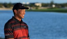 Tiger Woods smiles during a trophy presentation