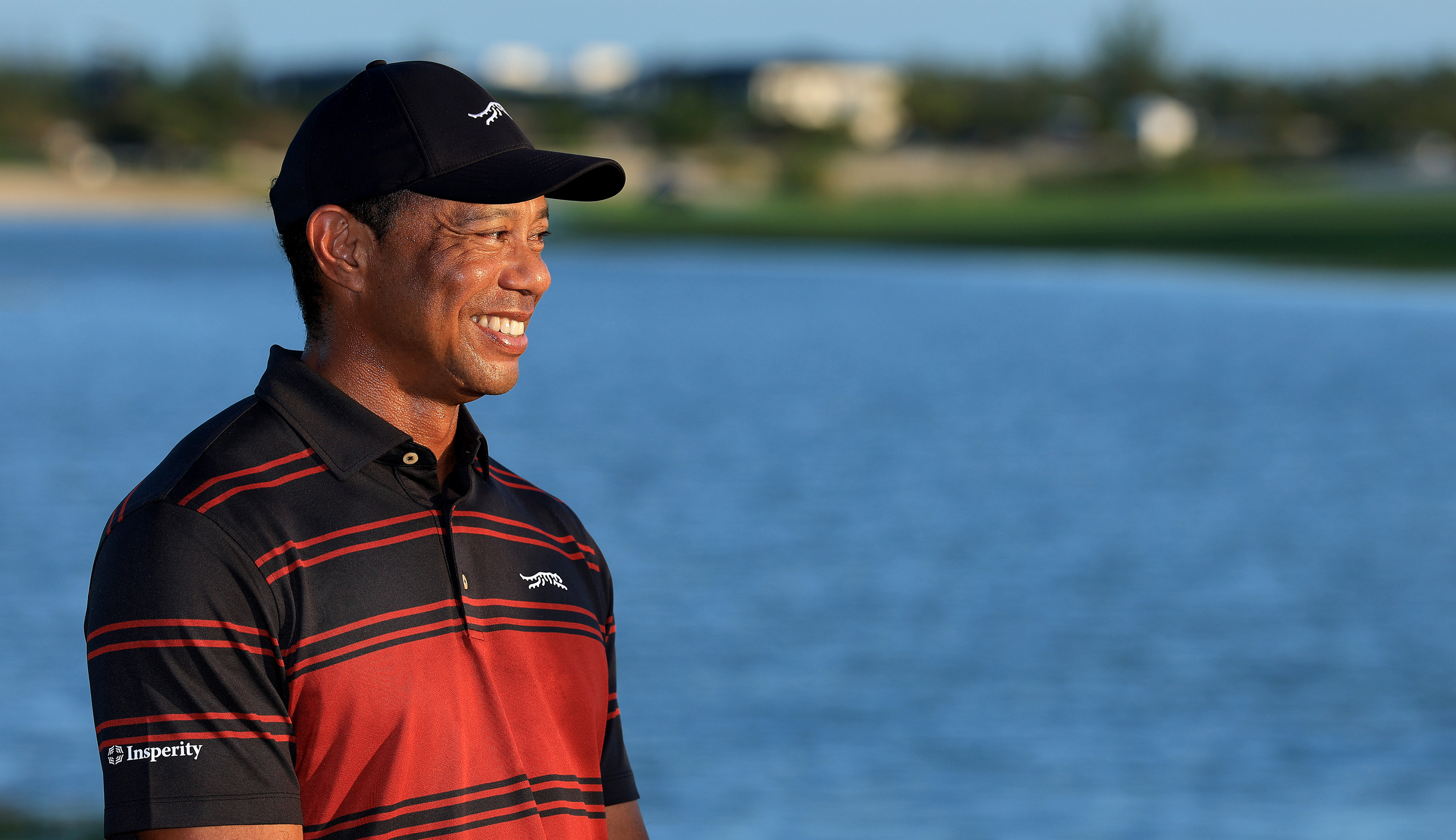 Tiger Woods smiles during a trophy presentation