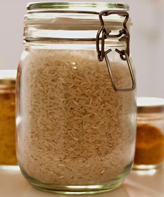 Glass jars with dried food goods inside
