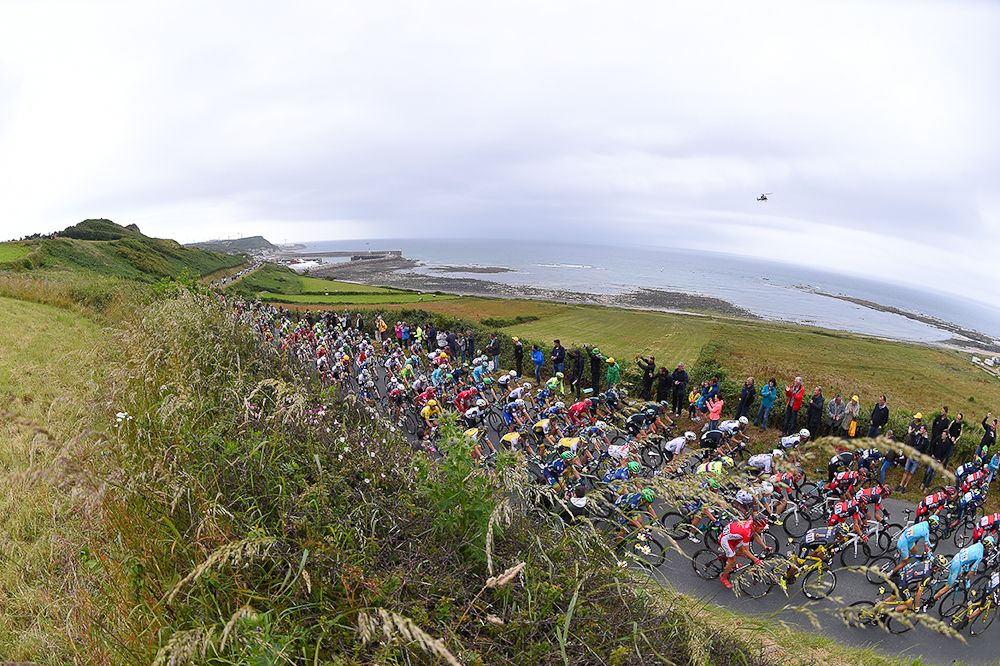 The peloton rides along the coast during stage 2