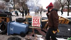 US-IMMIGRATION-ICE-SHOOTINGDemonstrators gather at the street where 37-year-old Renee Nicole Good was shot and killed at point blank range on January 7 by a US Immigration and Customs Enforcement (ICE) agent as she apparently tried to drive away from agents who were crowding around her car, in Minneapolis, Minnesota, on January 8, 2026. A US Immigration and Customs Enforcement (ICE) agent shot and killed an American woman on the streets of Minneapolis January 7, leading to huge protests and outrage from local leaders who rejected White House claims she was a domestic terrorist. The woman, identified in local media as 37-year-old Renee Nicole Good, was hit at point blank range as she apparently tried to drive away from agents who were crowding around her car, which they said was blocking their way. (Photo by CHARLY TRIBALLEAU / AFP via Getty Images)